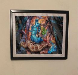 Disney Alice in wonderland art piece on black frame