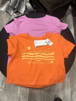 Girl teenage shirts says small, but it can be a medium too. I think rip curl brand never worn brand new. You can have both the shirts for $10.