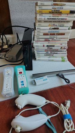 Nintendo Wii with 20 games works well two controllers