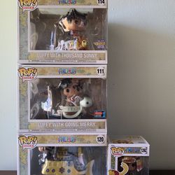 One Piece Funko Pops Luffy With Going Merry, Luffy With Thousand Sunny, Trafalgar Law With Polar Tang , Armored Luffy 