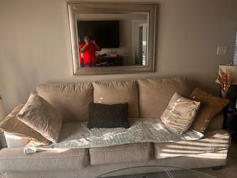 Couch, coffee table with two end tables, large mirror