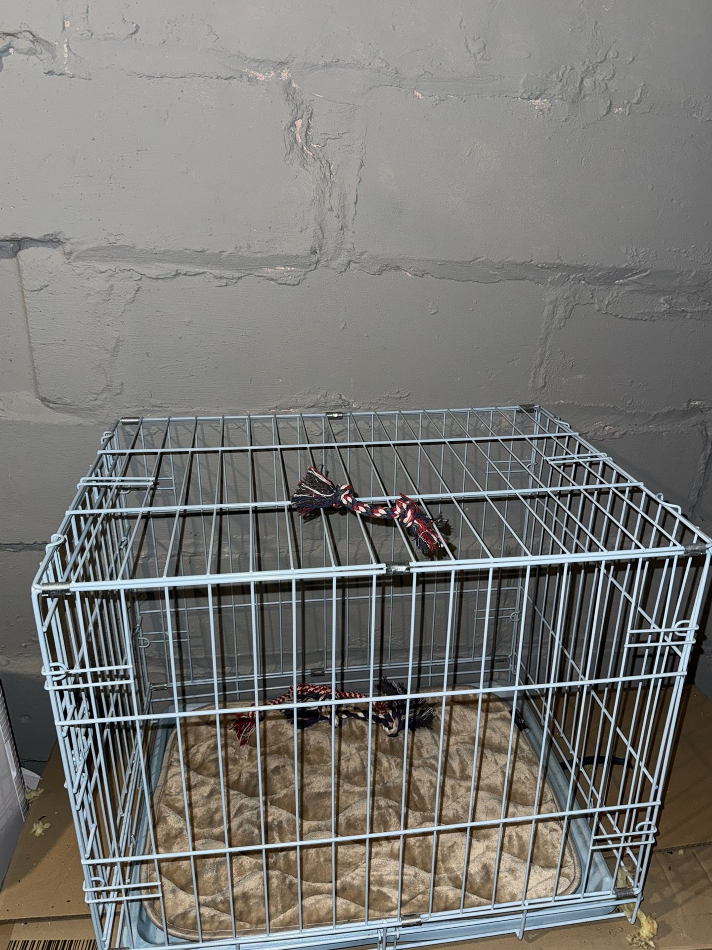 Small blue dog cage
