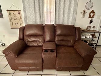 Brown faux leather reclining loveseat