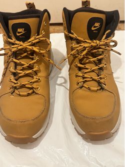 Sturdy high-top boots from Nike with a wheat tan leather-like upper. Padded collar and cushioned tongue for comfort. Secure lace-up front with metal e