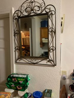 Espejo de fierro rectangular con  2 candeleros