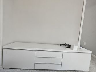 IKEA BESTÅ BURS TV unit in high-gloss white.