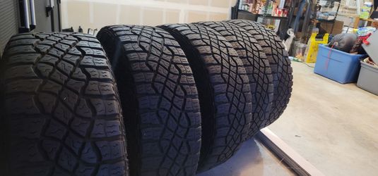 (5) Goodyear Wrangler Territory M/T 305/70R18 – 35" Tires