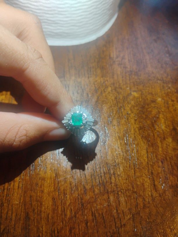 Ring With Diamonds With A Emerald In The Middle