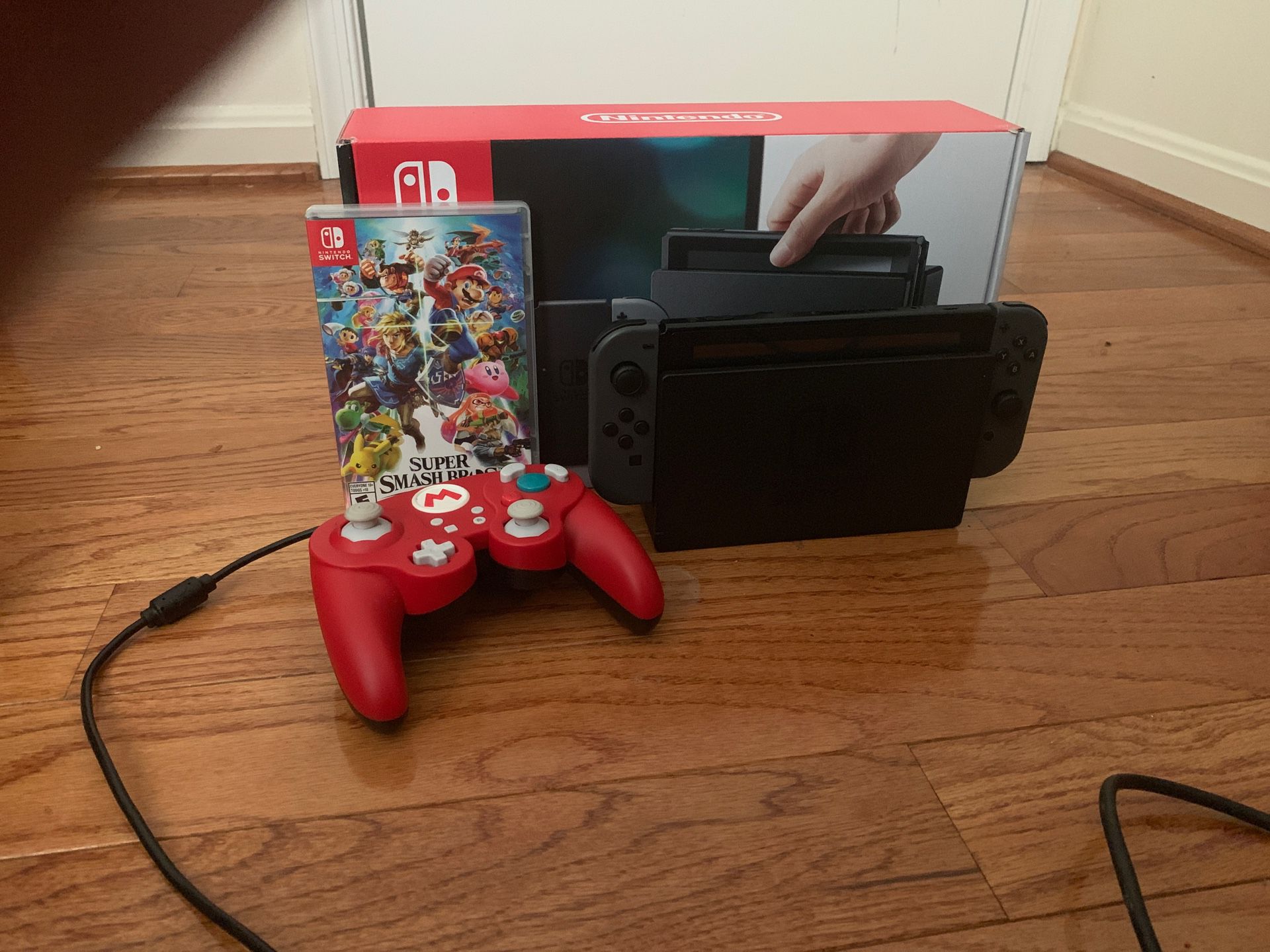 Nintendo Switch with Smash Bros ultimate and a PDP GameCube controller