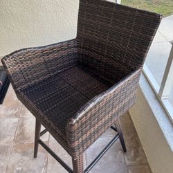 wicker swivel counter-height bar stool with arms. 