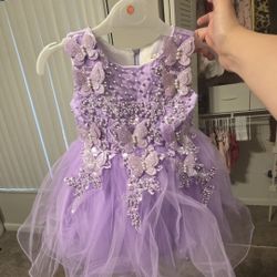 Dressed as a child, 1 year old. 