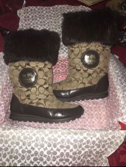 Gently used Coach winter/rain boots. Size 6. Still in Box. Asking 60.00