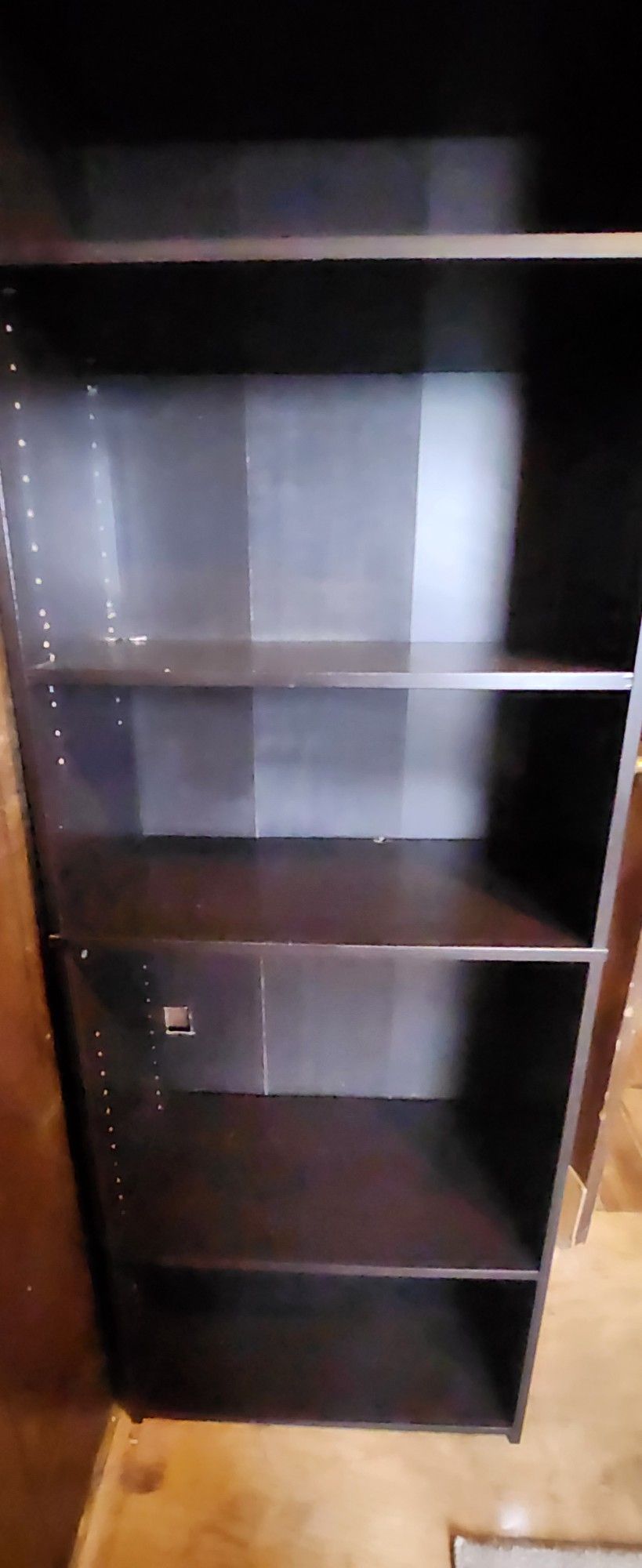 Tall Black Shelf In Good Condition some shelves are adjustable. has some mirrors on side.