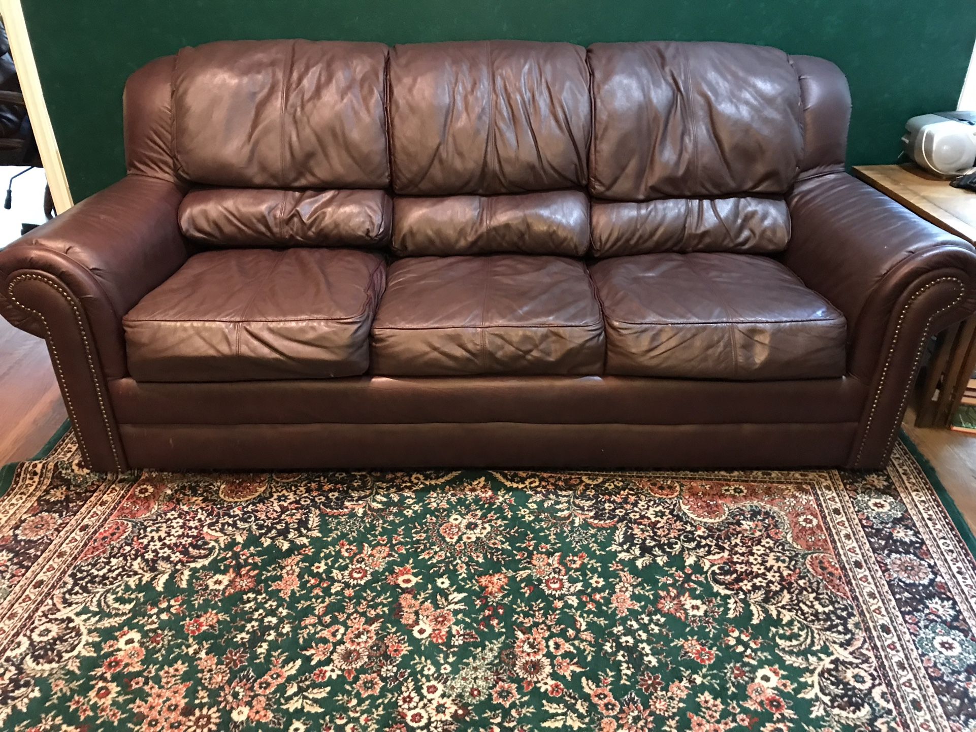 Burgundy Faux leather sofa couch with pull out mattress/bed sleeper