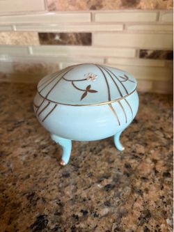 Vintage porcelain trinket box with gold design