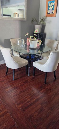 Round glass table and 4 upholstered chairs