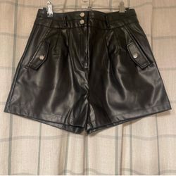 Black faux leather shorts