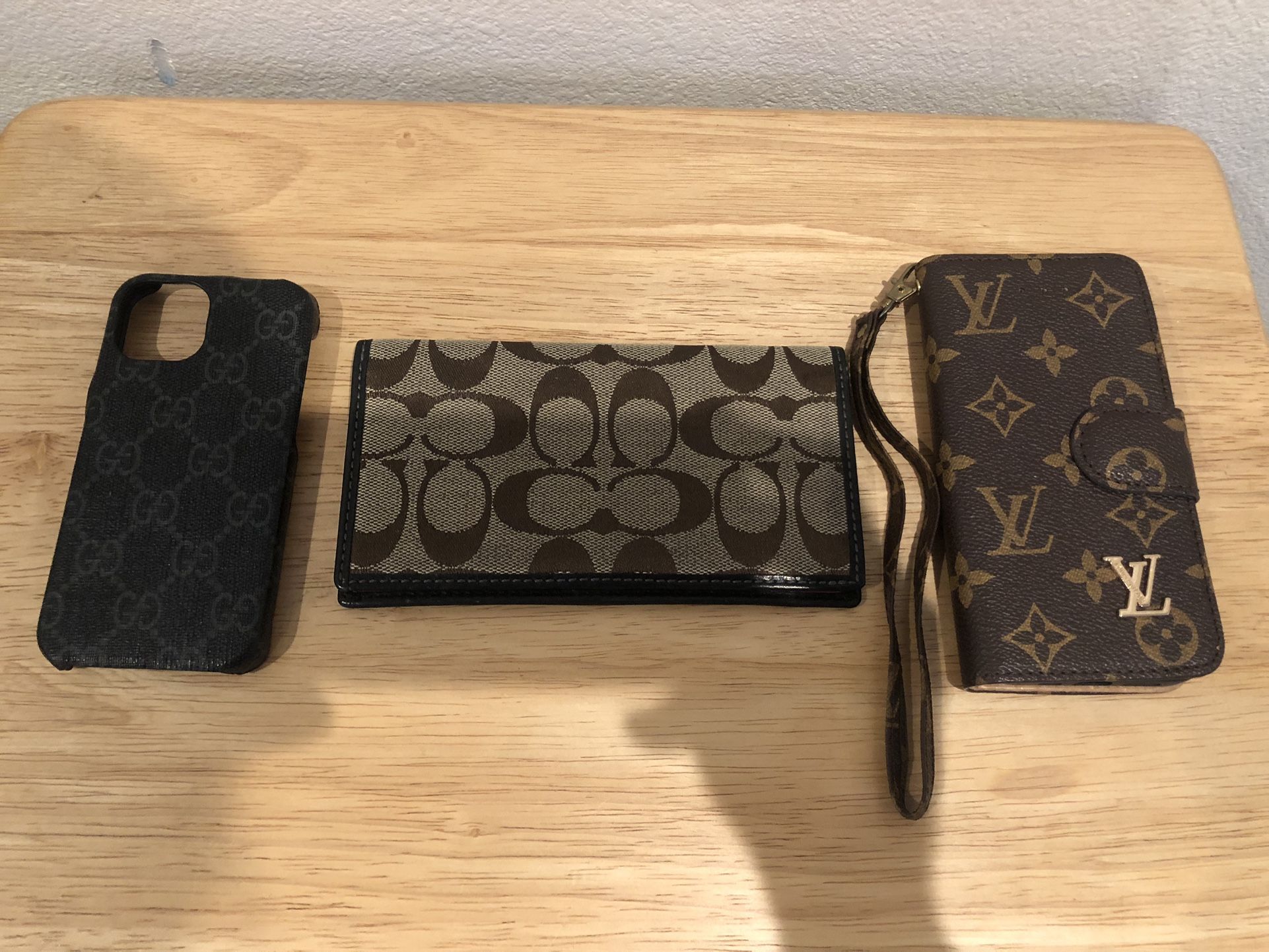 Phone Cases And A Coach Checkbook Bundle