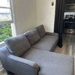 Signature Design by Ashley Jarreau Modern Sectional Sleeper Sofa Couch with Chaise Lounge, Blue