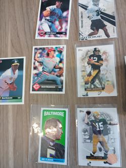About 202 football cards and 3 baseball cards