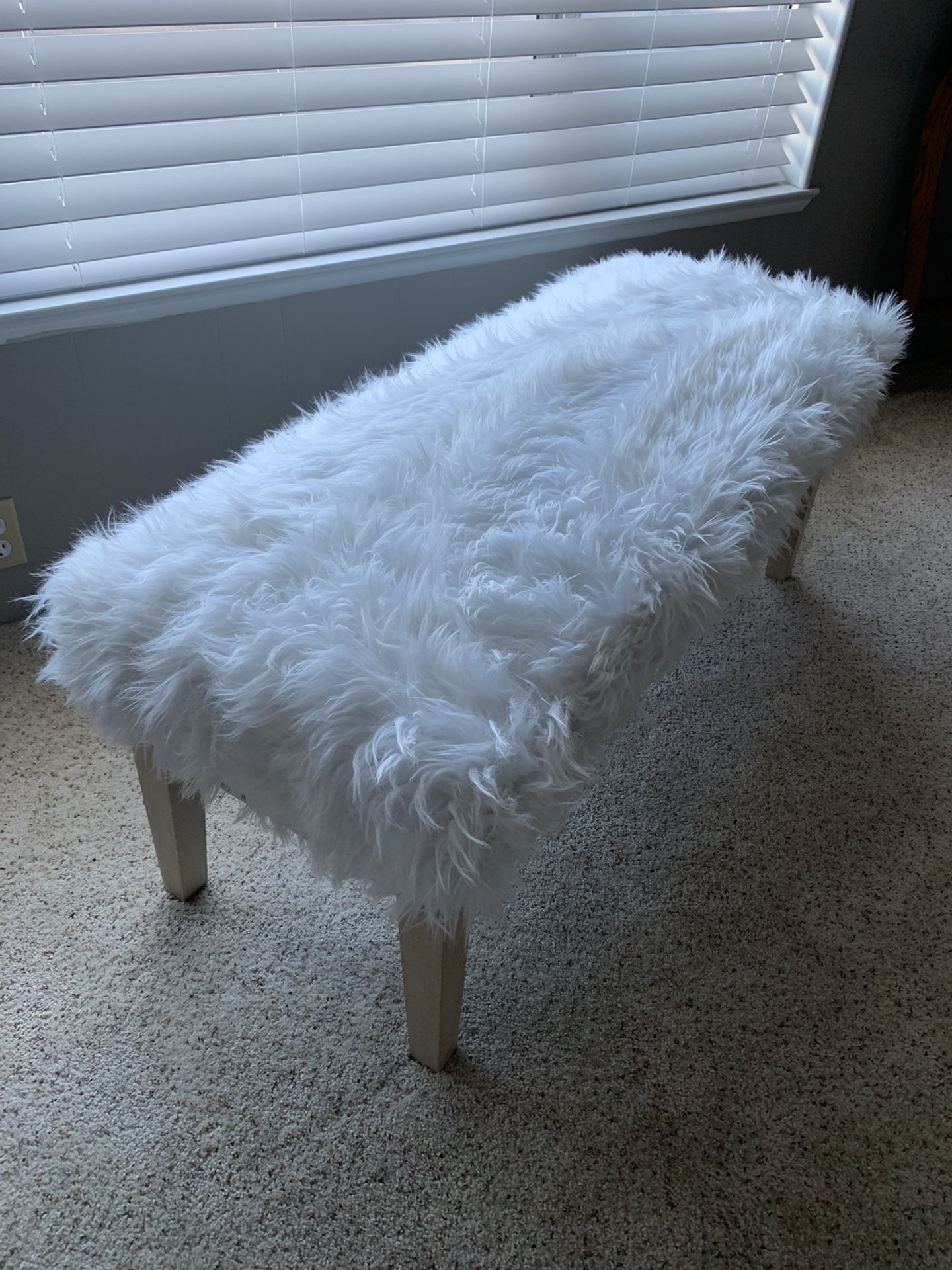 Footboard Bench Seating With White Faux Fur