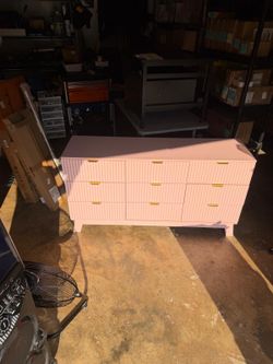 Pink 9 drawer dresser with gold accent