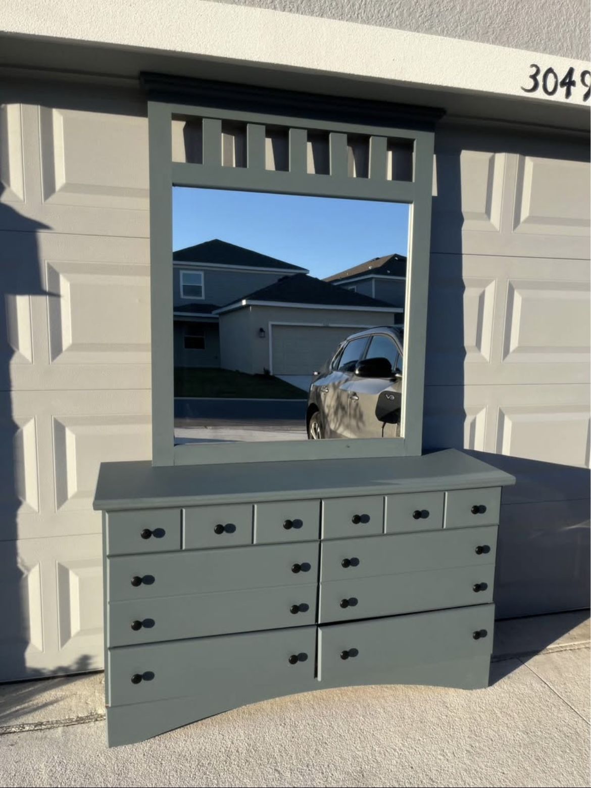 Blueish dresser with mirror