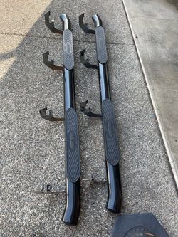 Aries 4” black steel oval side bars fit GM and Silverado