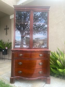 Selling a Vintage serpentine 3 drawer 2 shelf Hutch in good solid condition minor blemishes on legs