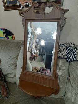 Mirror with a shelf hang on wall