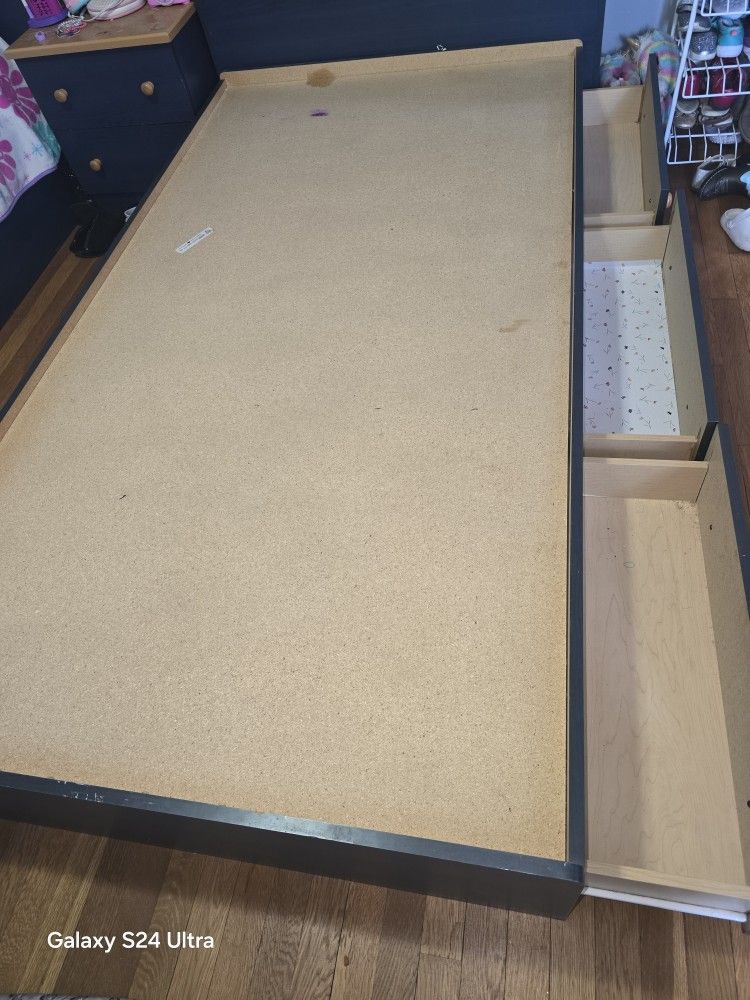 two Twin bed frames with 3 drawers underneath