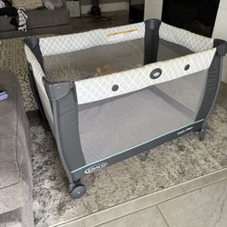 Pack And Play With Changing Table And Storage Connection 