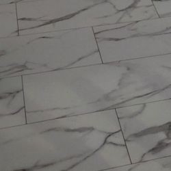 
The Lifeproof Brookfield Marble 22 MIL x 11.9 in. W x 23.8 in. L Click Lock Waterproof Vinyl Tile