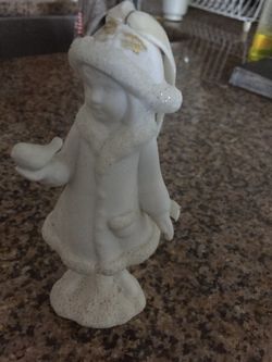 statuette girl with a bird