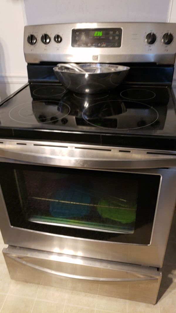 Kenmore stove stainless stove with five cook top plates flat with glass