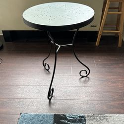 2 solid black Tables