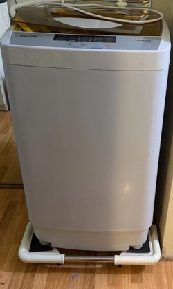 Portable laundry machine also includes rollers
