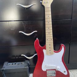 Red Electric Guitar With Amp
