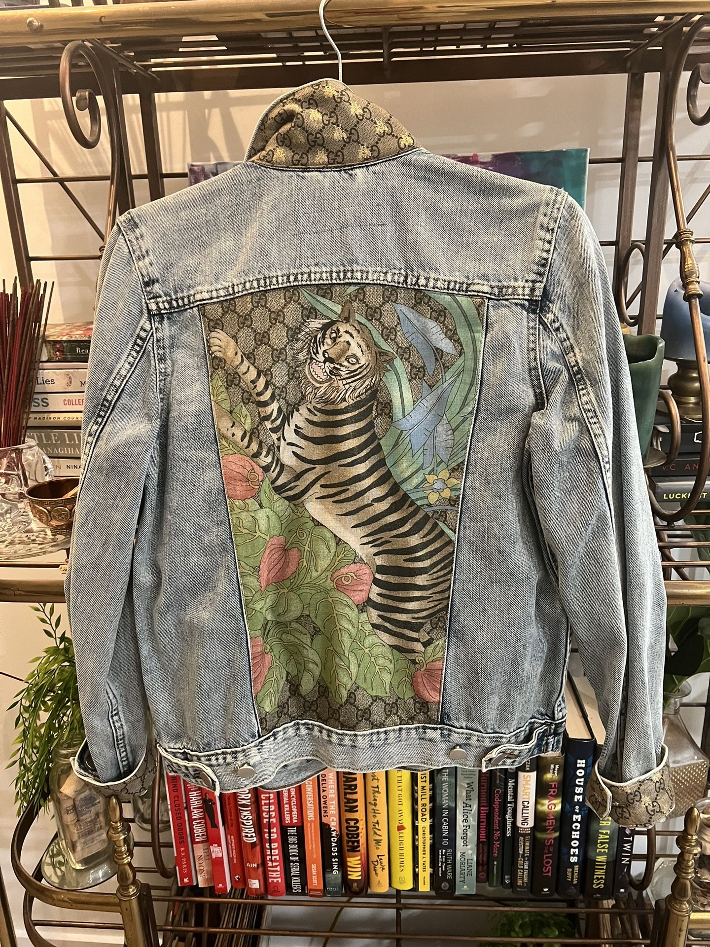 Collector’s item: denim jacket featuring vintage silk Gucci scarf accents. 