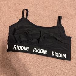 Black sports bralette with  RIDDIM elastic band. Lightweight, stretchy fabric for gentle support. Thin adjustable straps for a custom fit. Simple silh
