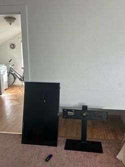 Roku TV with remote and stand