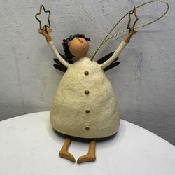 This is a Christmas angel figurine from the Mistletoe Manor collection.