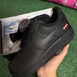 Supreme black Air Force 1s