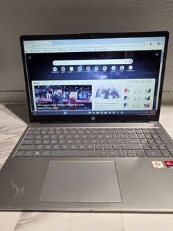 Sleek HP laptop. Has AMD Athlon processor and AMD Radeon Graphics. Features HDMI, USB-C, and USB-A ports.