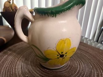Antique ceramic wall pocket with flower design
