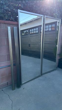 Mirror sliding closet doors