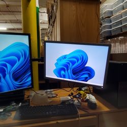 Duo monitors with stands and all cables hook up
