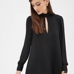 Black dress with sheer sleeves and slit at the neckline