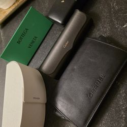 Chanel, Cartier, Prada, Botega Veneta and Versace sunglass cases empty