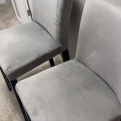 2 Island chairs, gray rhinestone, all in good condition asking 50$ if you take both